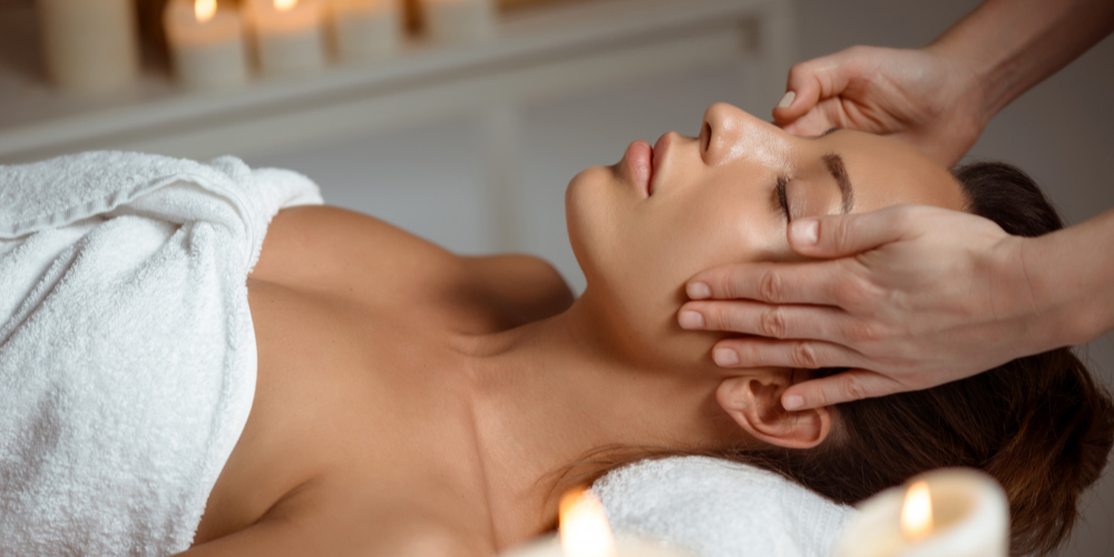 young-woman-having-face-massage-relaxing-in-spa-salon 2.png