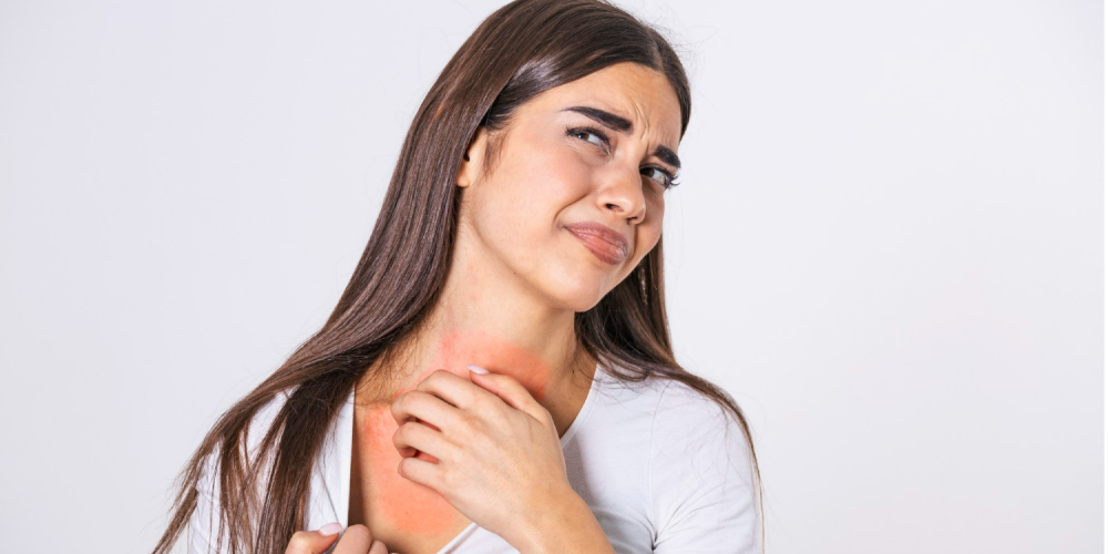 young-woman-scratching-her-neck-due-to-itching-on-a-gray-background-female-has-an-itching-neck-the-concept-of-allergy-symptoms-and-healthcare 1.png